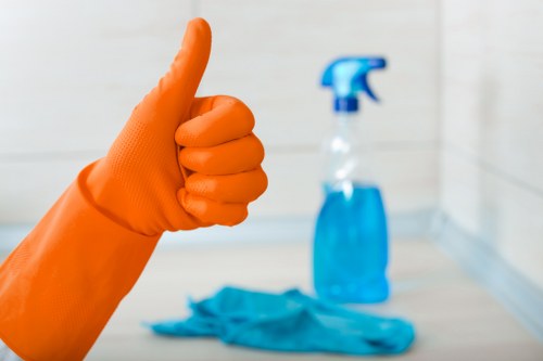 Professional cleaner preparing a meeting room in SW16